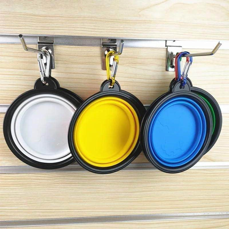 Set of foldable silicone pet bowl in white yellow blue and green colors hanging with carabiner clips