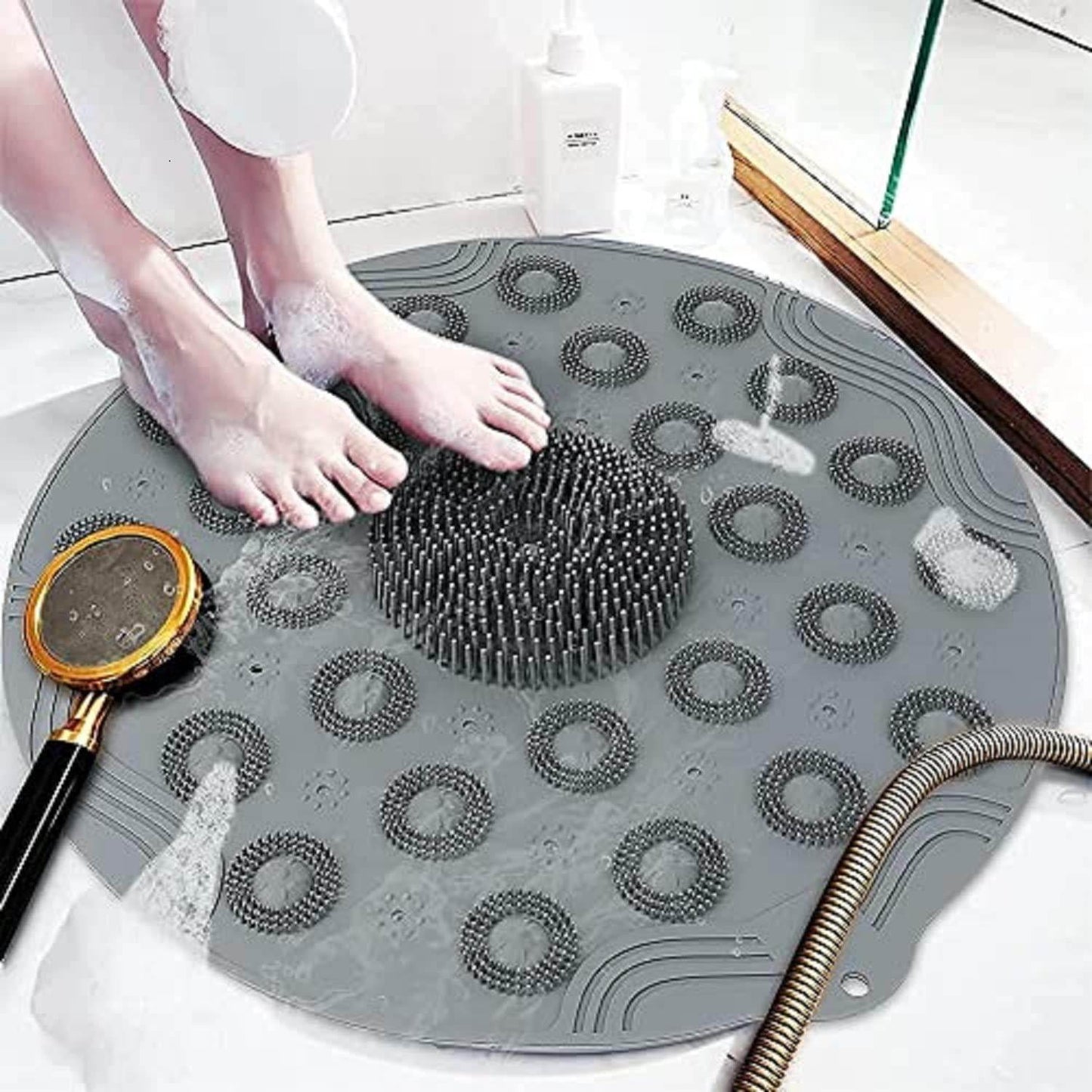 Gray foot scrubber mat for shower with textured bristles and suction cups under feet in wet shower