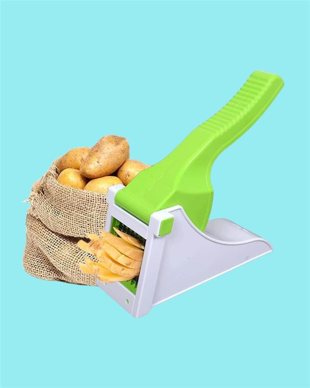 Heavy duty vegetable chopper with green handle slicing potatoes next to a burlap sack of whole potatoes