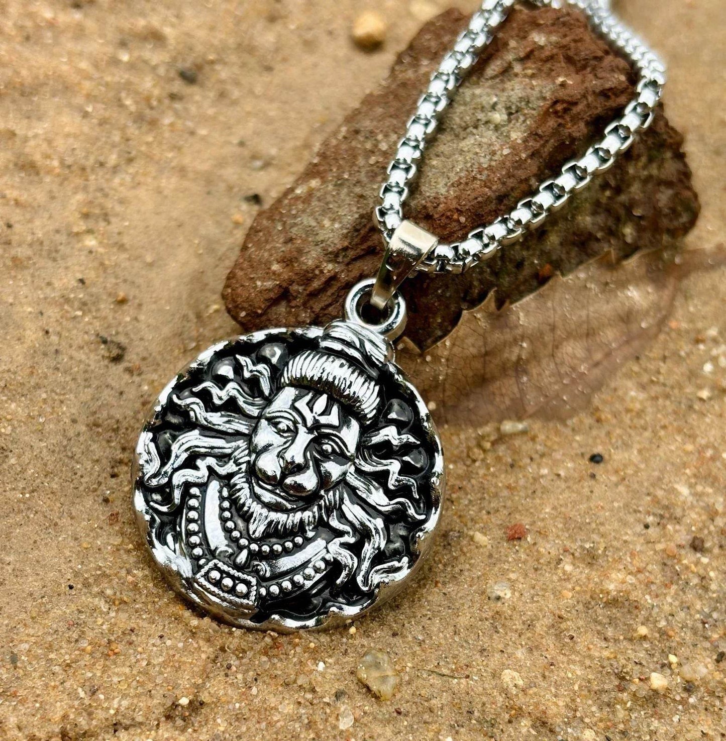 Silver Lord Hanuman pendant necklace with detailed lion face design on a chain