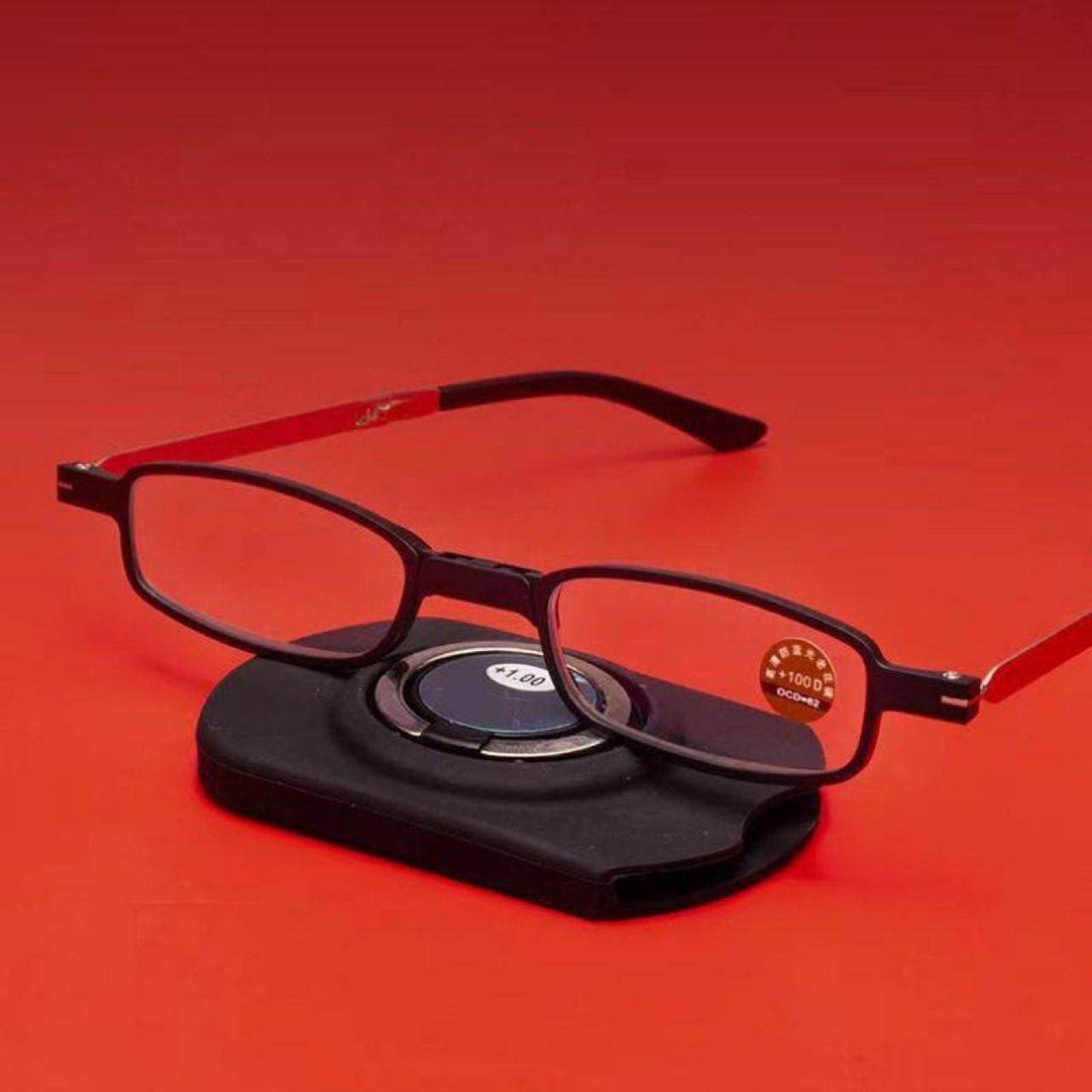 Black and red portable reading glasses UV400 with a compact black folding case on red background