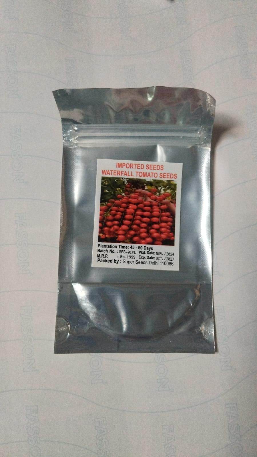 Silver foil packet of imported waterfall tomato seeds with image of red tomatoes on label