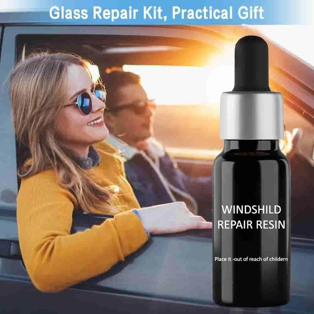 Black bottle of windshield repair resin with dropper beside smiling woman and man in car window