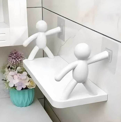White bathroom organizer shelf for small spaces mounted on tiled wall with decorative figures and flowers