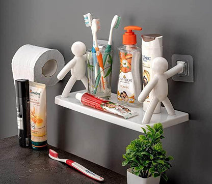 Bathroom organizer shelf for small spaces with toothbrushes, toothpaste, soap, and decorative figures mounted on wall