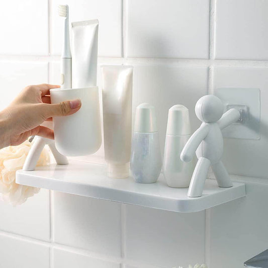White bathroom organizer shelf for small spaces holding toiletries with suction cup installation