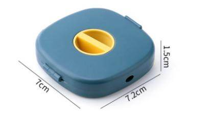 Compact USB cable holder in blue with yellow winding slot and dimensions 7.2 by 7 by 1.5 centimeters