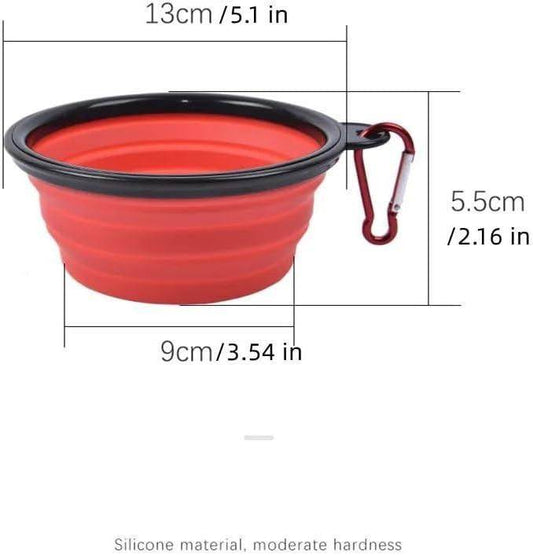 Red foldable silicone pet bowl with black rim and attached carabiner clip for easy carrying