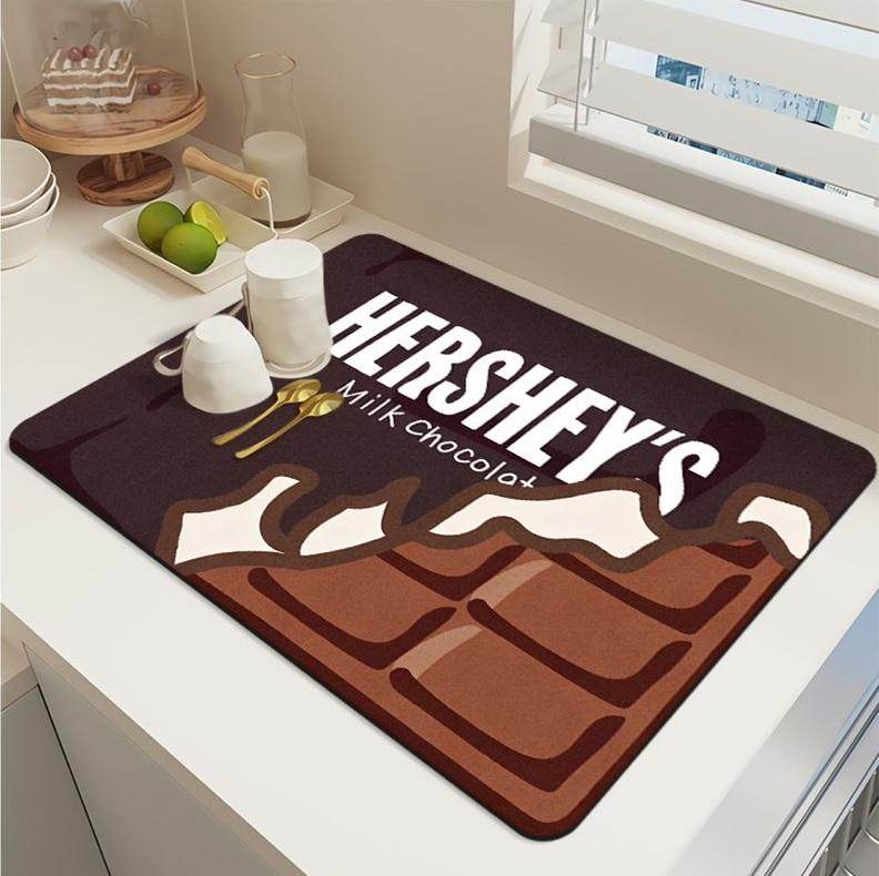 Hershey's chocolate bar design modern kitchen drying pad on white countertop with cups and utensils