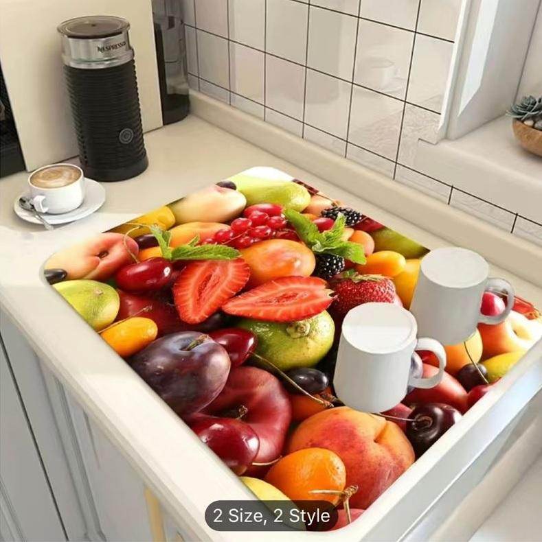 Colorful fruit design modern kitchen drying pad on countertop with white mugs and coffee cup