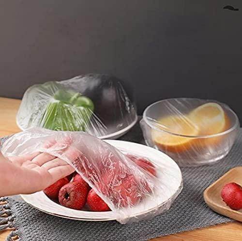 Clear reusable food storage covers being used to cover bowls with fruits and vegetables
