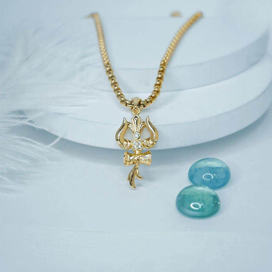 Elegant gold Trishul pendant with chain featuring a central gemstone on a stylish necklace