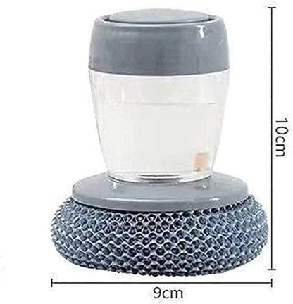 Gray kitchen soap dispensing palm brush with transparent soap container and textured scrubber base