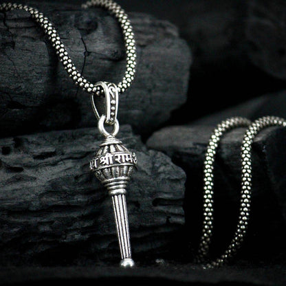 Silver Lord Hanuman pendant necklace with intricate design on a matching chain displayed on dark textured background