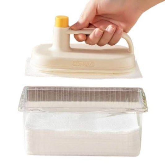 Disposable cleaning brush with handle being held above clear plastic container with white cleaning pads