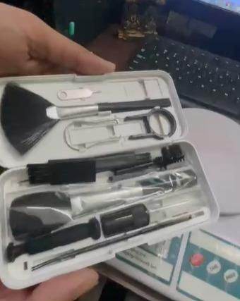 Multifunctional cleaner brush set in white case with various cleaning tools for electronic devices