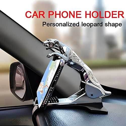 Jaguar dashboard phone holder in silver leopard shape securely holding a smartphone on car dashboard