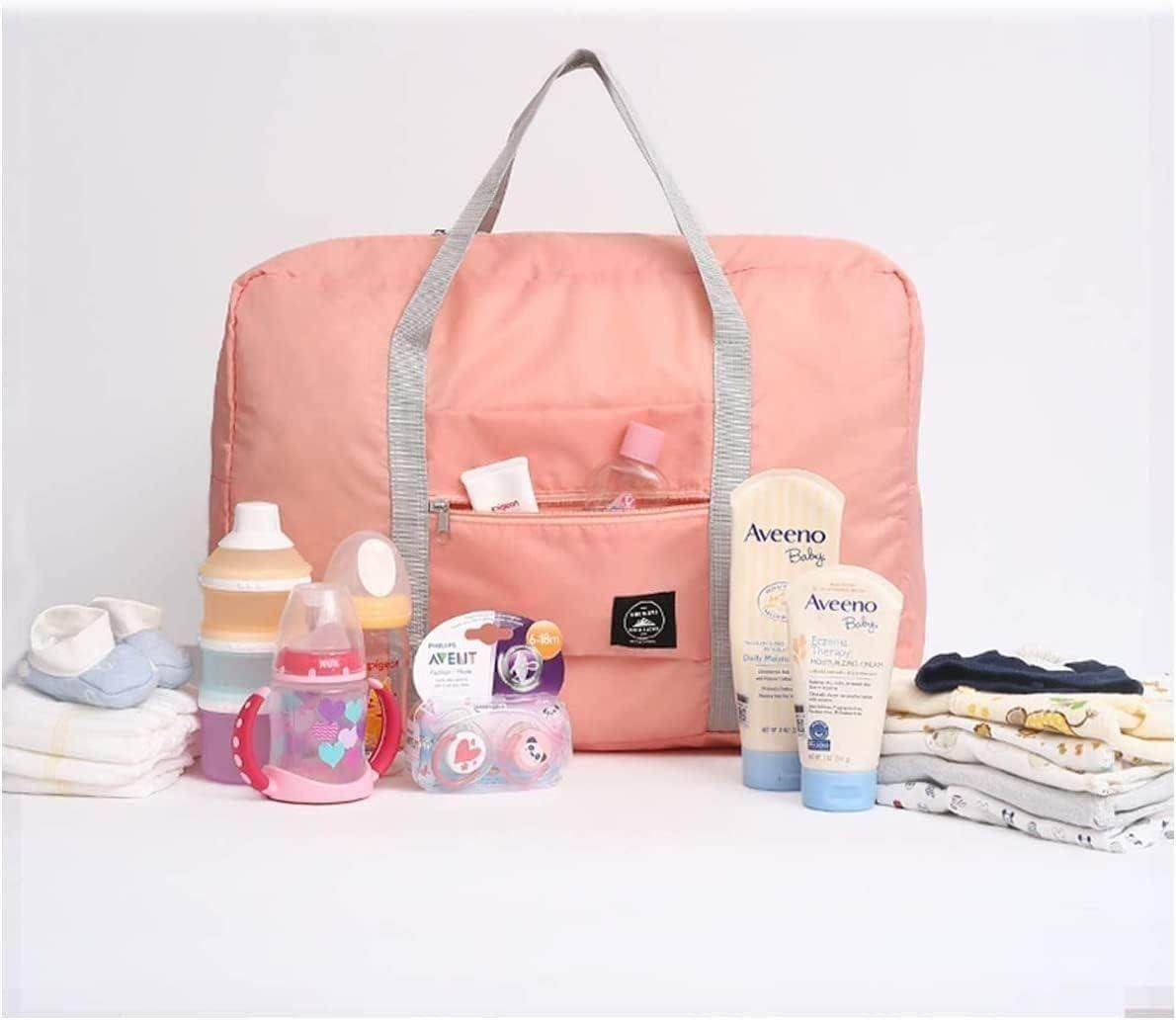 Pink foldable travel tote bag with baby essentials including bottles, clothes, and lotions