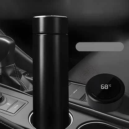 Black smart thermos bottle with temperature display showing 68 degrees Celsius in car cup holder