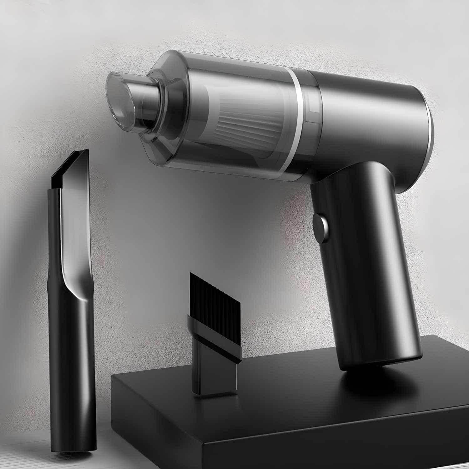 Black wireless mini vacuum cleaner with transparent dust container and two cleaning attachments on black stand